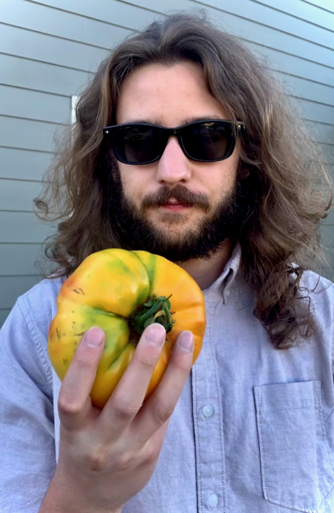 Josh holding a tomato